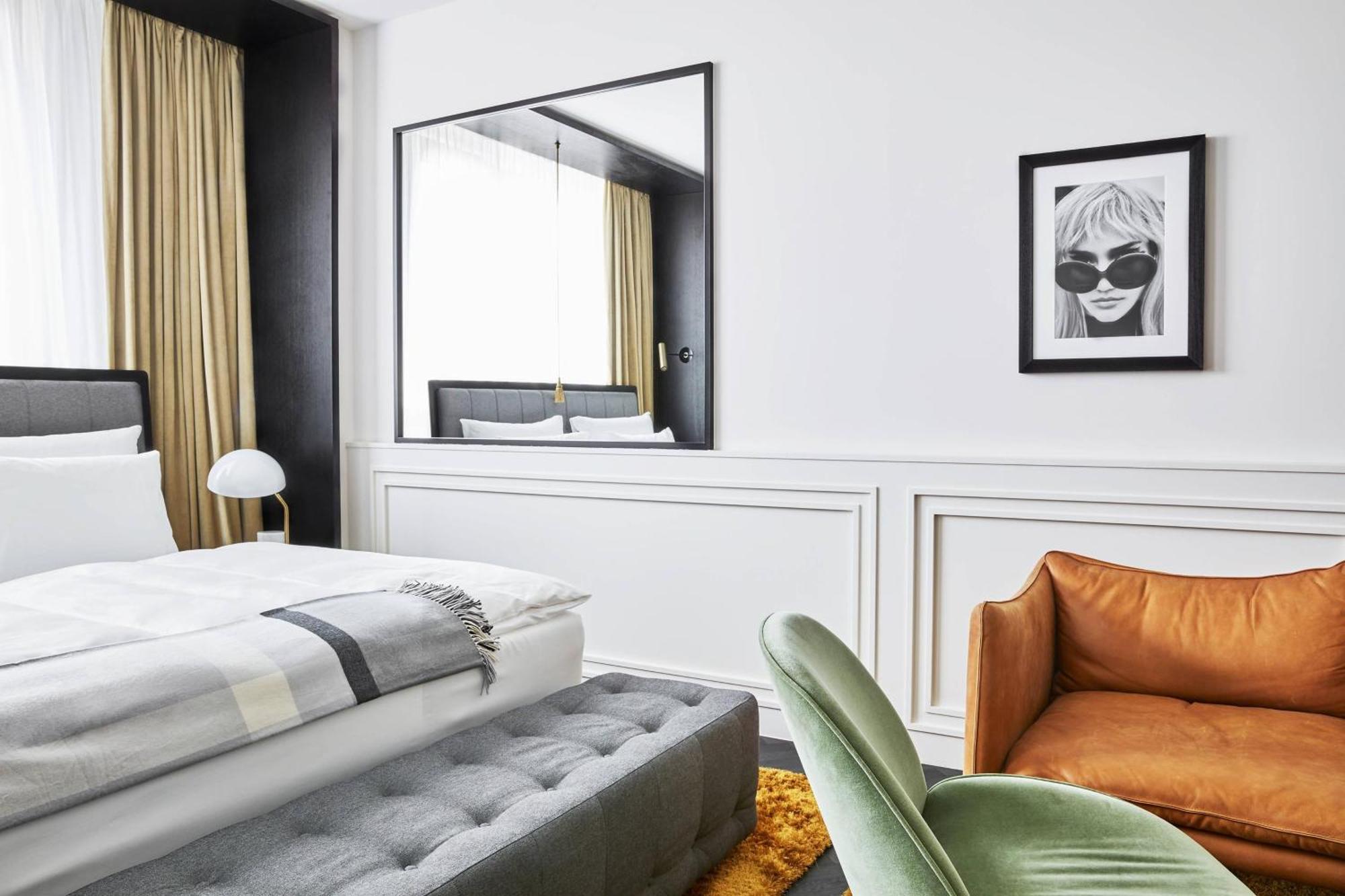 Roomers Munich, Autograph Collection Ngoại thất bức ảnh A bedroom at the hotel